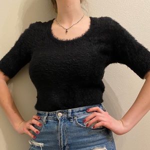 Black fuzzy sweater from Knitted and Knotted. Size M